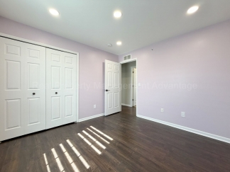 Rare Corner Upper Condo with Vaulted Ceilings, Private Balcony and 2 Car Garage - Right Across from the GM Tech Center!