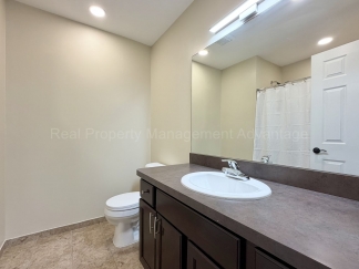 Rare Corner Upper Condo with Vaulted Ceilings, Private Balcony and 2 Car Garage - Right Across from the GM Tech Center!