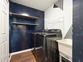 Rare Corner Upper Condo with Vaulted Ceilings, Private Balcony and 2 Car Garage - Right Across from the GM Tech Center!