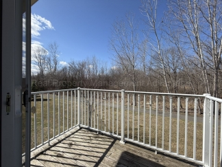 Rare Corner Upper Condo with Vaulted Ceilings, Private Balcony and 2 Car Garage - Right Across from the GM Tech Center!