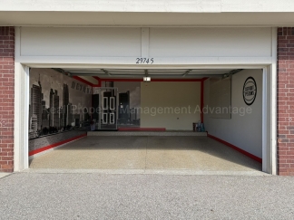Rare Corner Upper Condo with Vaulted Ceilings, Private Balcony and 2 Car Garage - Right Across from the GM Tech Center!