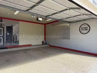 Rare Corner Upper Condo with Vaulted Ceilings, Private Balcony and 2 Car Garage - Right Across from the GM Tech Center!