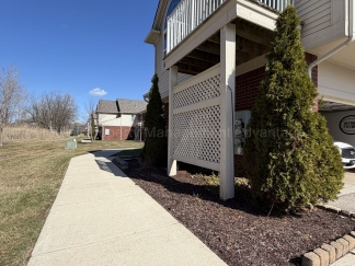 Rare Corner Upper Condo with Vaulted Ceilings, Private Balcony and 2 Car Garage - Right Across from the GM Tech Center!