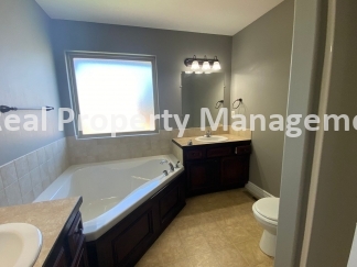 Beautiful  Home with 3 Car Garage and Fenced Yard