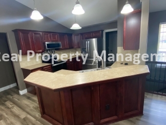 Beautiful  Home with 3 Car Garage and Fenced Yard