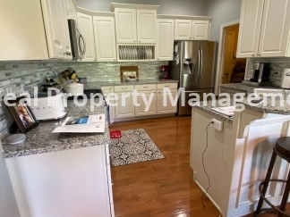 Beautiful Modern Home w/3 Car Garage, Fenced in Yard & Finished Basement
