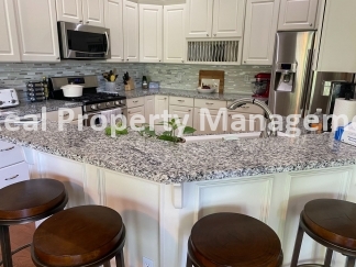 Beautiful Modern Home w/3 Car Garage, Fenced in Yard & Finished Basement