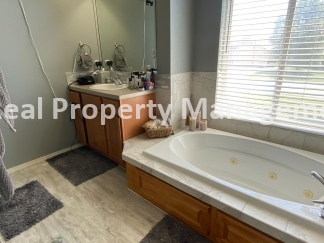 Beautiful Modern Home w/3 Car Garage, Fenced in Yard & Finished Basement
