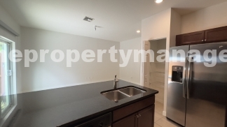 Spacious 3-Bedroom Townhouse with Gleaming Hardwood Floors in West Palm Beach!