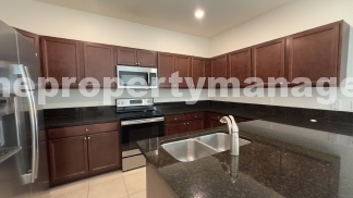 Spacious 3-Bedroom Townhouse with Gleaming Hardwood Floors in West Palm Beach!
