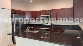 Spacious 3-Bedroom Townhouse with Gleaming Hardwood Floors in West Palm Beach!