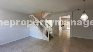 Spacious 3-Bedroom Townhouse with Gleaming Hardwood Floors in West Palm Beach!
