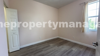 Spacious 3-Bedroom Townhouse with Gleaming Hardwood Floors in West Palm Beach!