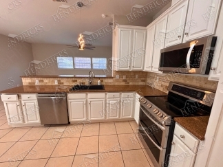 Spacious 4 Bedroom Stone Oak Home with Three Car Garage