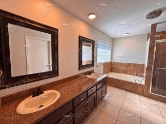 Spacious 4 Bedroom Stone Oak Home with Three Car Garage