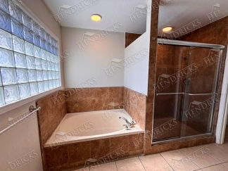 Spacious 4 Bedroom Stone Oak Home with Three Car Garage