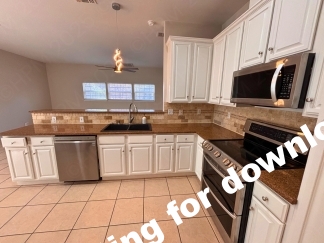 Spacious 4 Bedroom Stone Oak Home with Three Car Garage